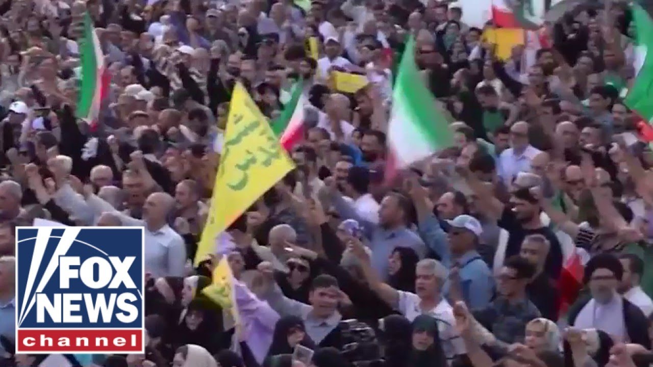 Iranians wave ‘Down with USA’ flags in streets of Tehran